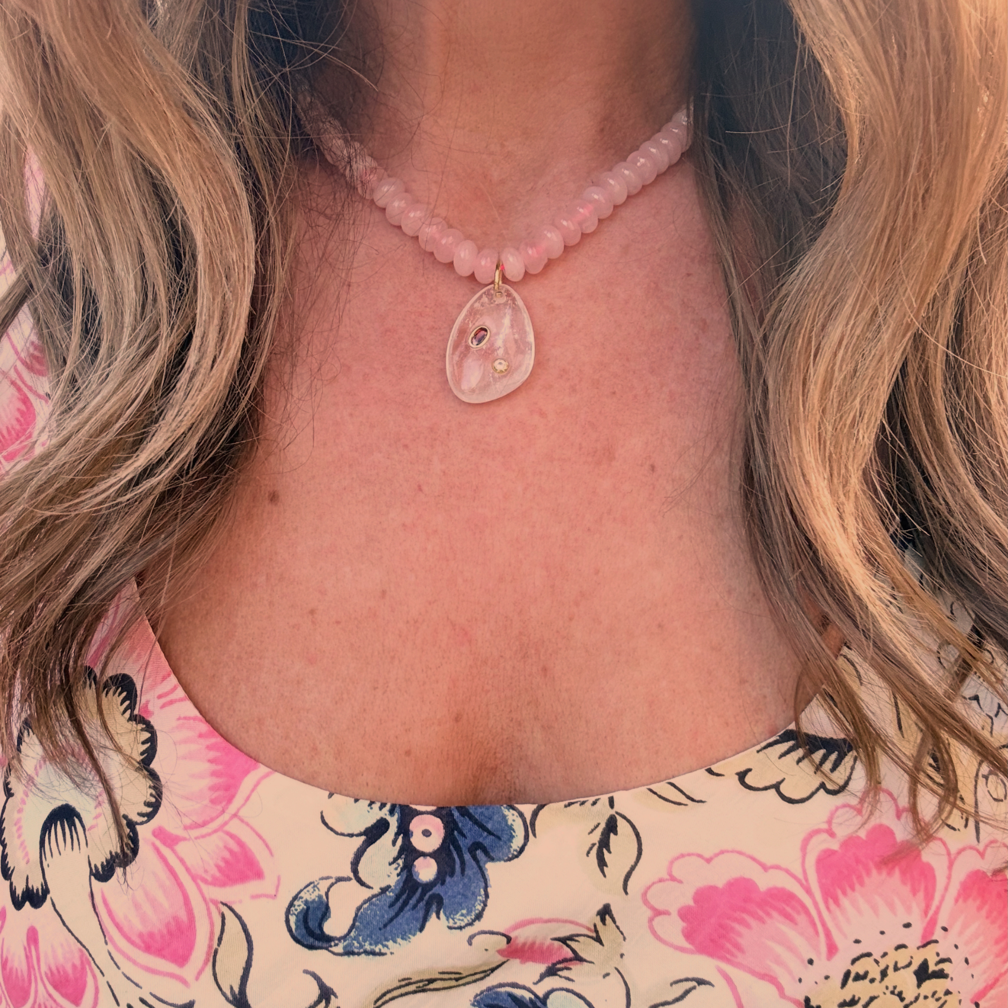 Rose quartz beads with clear quartz pendant